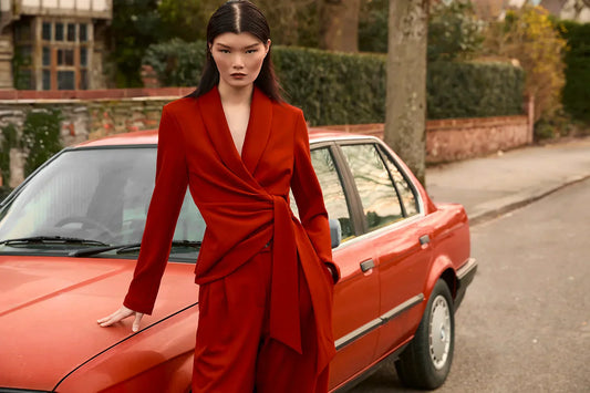 Red coordinated side sash suit styled for elegant evening occasion dressing