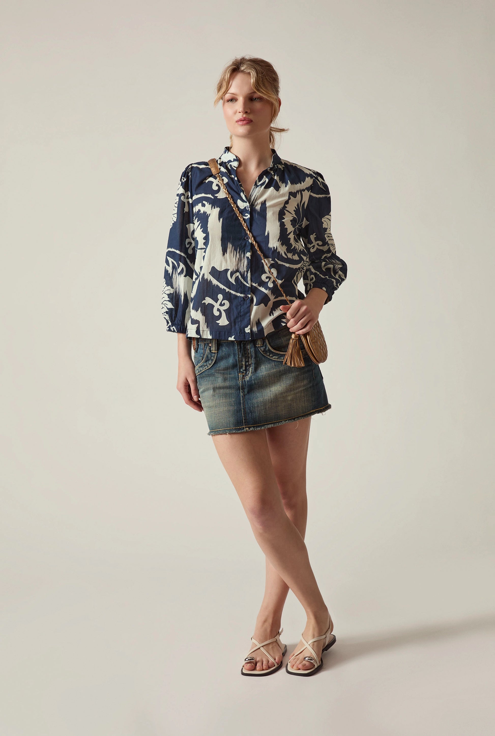 Woman styling the Ornamental Print Shirt in Navy and Cream by James Lakeland with denim skirt