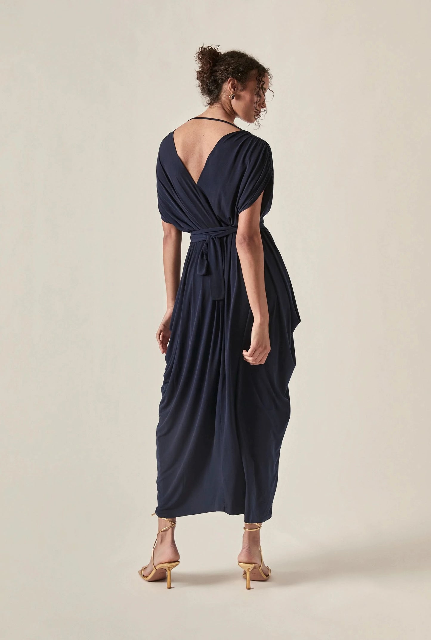 Back view of the Draped Open-Back Midi Dress in Navy by James Lakeland showing the draped open-back detail