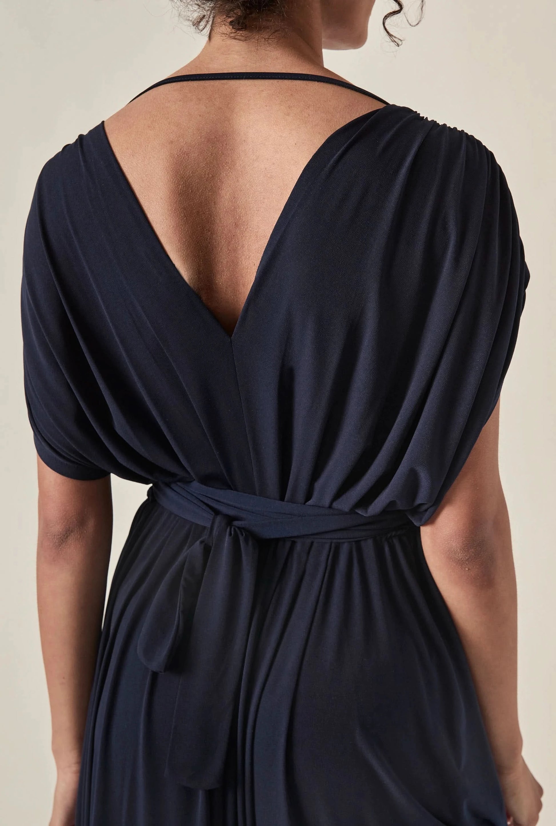 Close-up detail of the draped back and fabric on the James Lakeland Navy Midi Dress