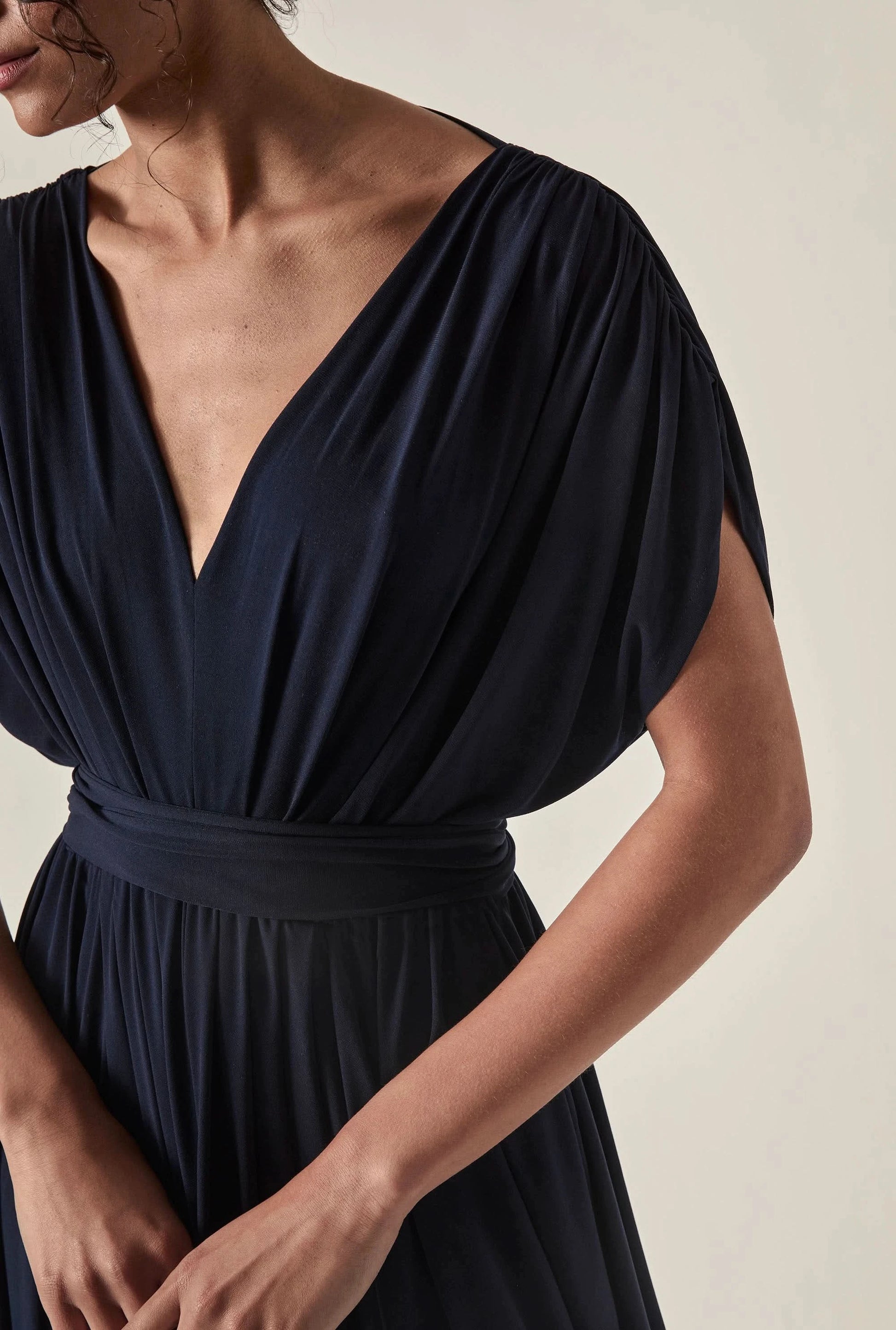 Side view of the Draped Open-Back Midi Dress in Navy by James Lakeland showing the fluid midi silhouette