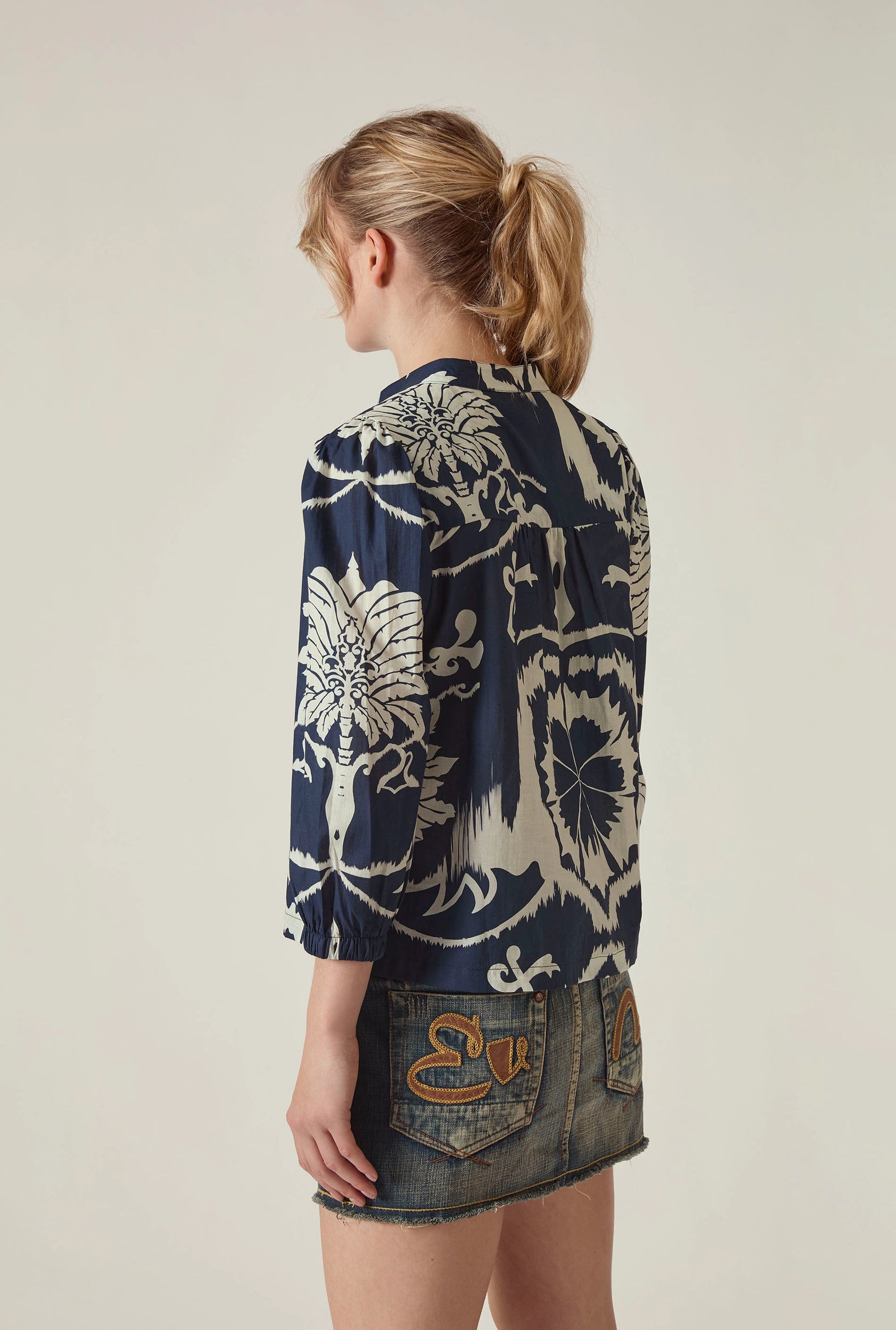 Side view of the Ornamental Print Shirt in Navy and Cream by James Lakeland with relaxed silhouette and three quarter sleeves
