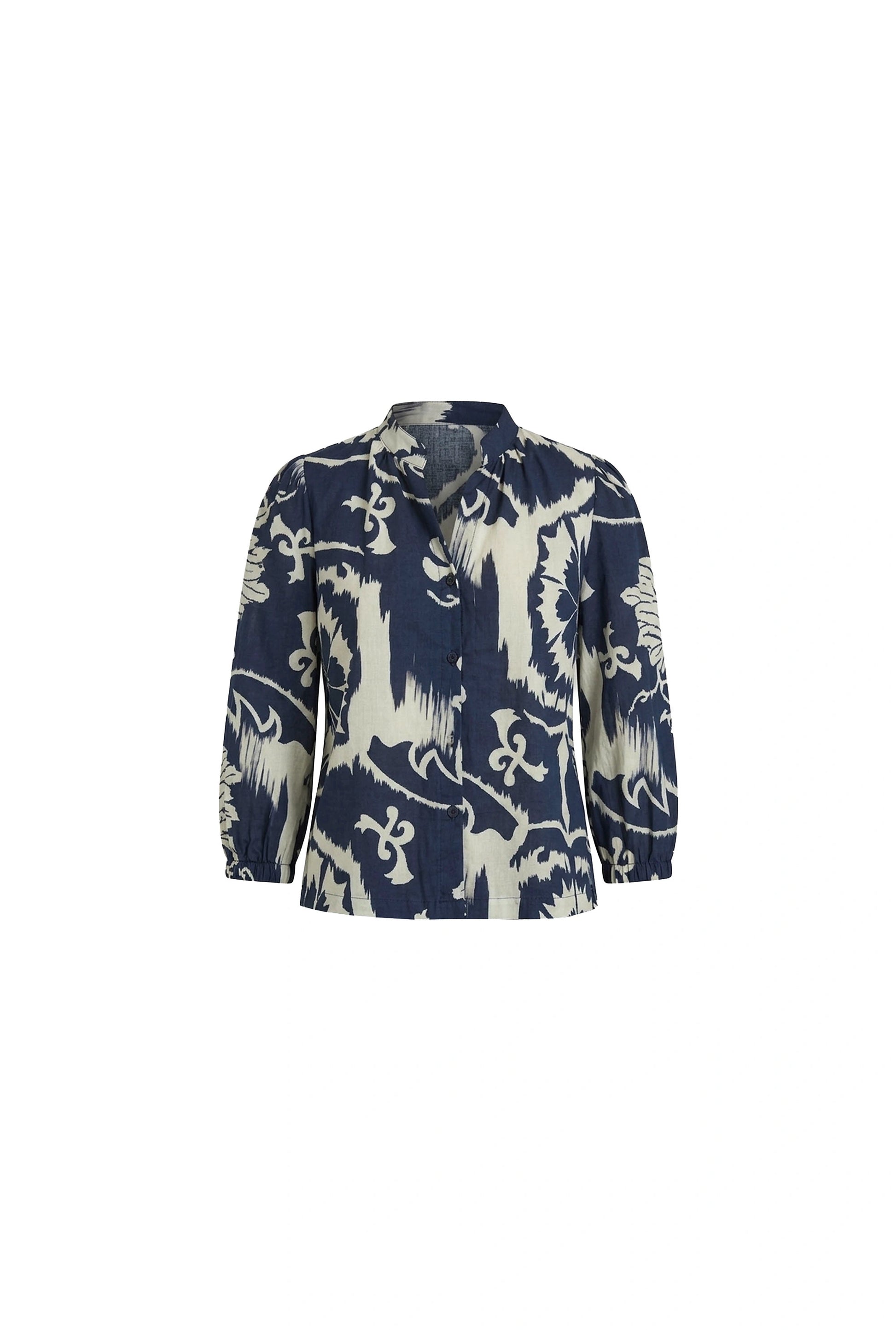Detail of the navy and cream ornamental print cotton fabric on the James Lakeland shirt