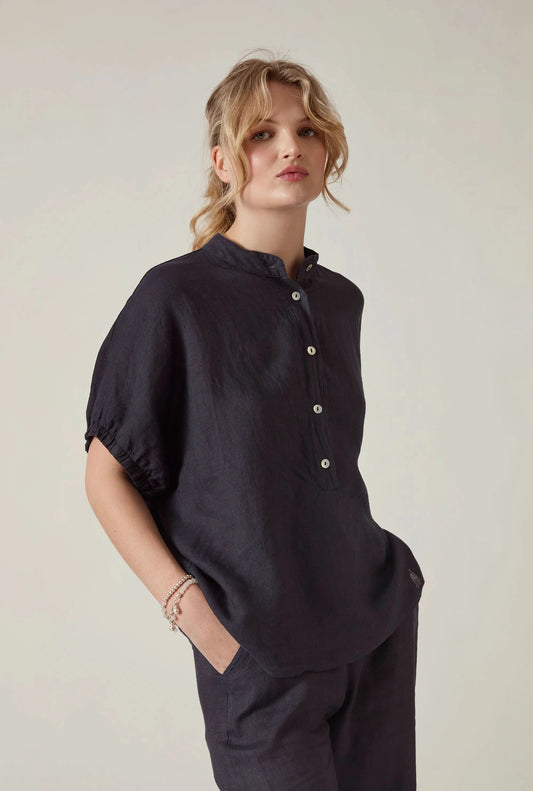 Front view of the Relaxed Navy Linen Blouse by James Lakeland against a beige studio background
