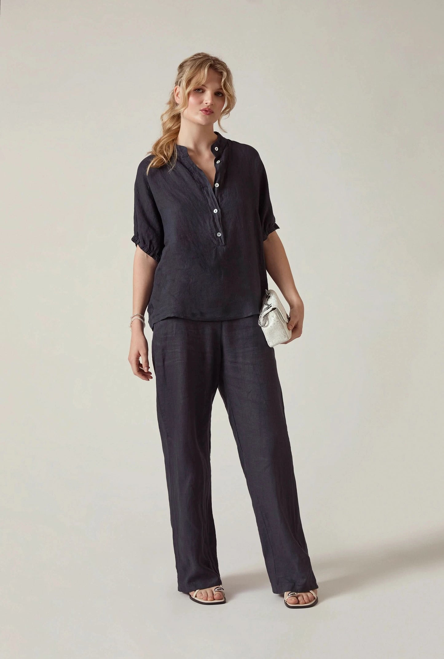 Model wearing the Relaxed Navy Linen Blouse by James Lakeland with relaxed elegant styling
