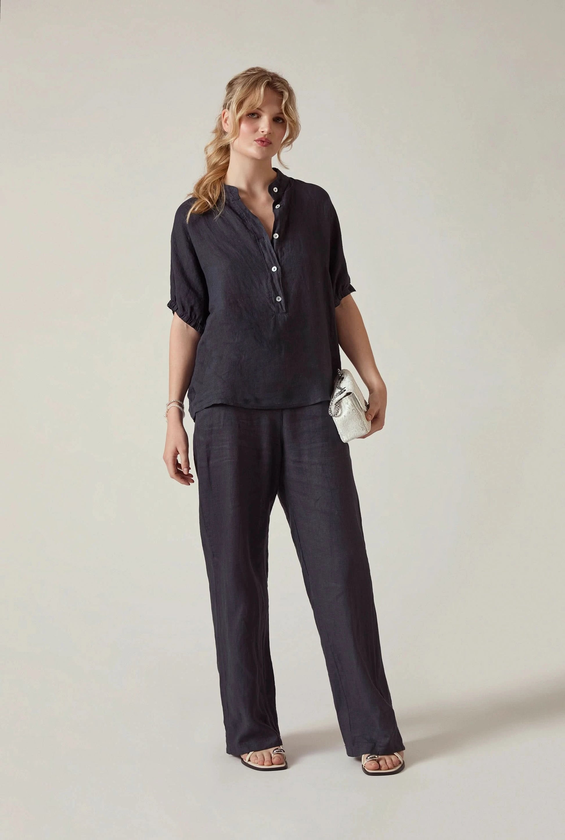Model wearing the Relaxed Navy Linen Blouse by James Lakeland with relaxed elegant styling
