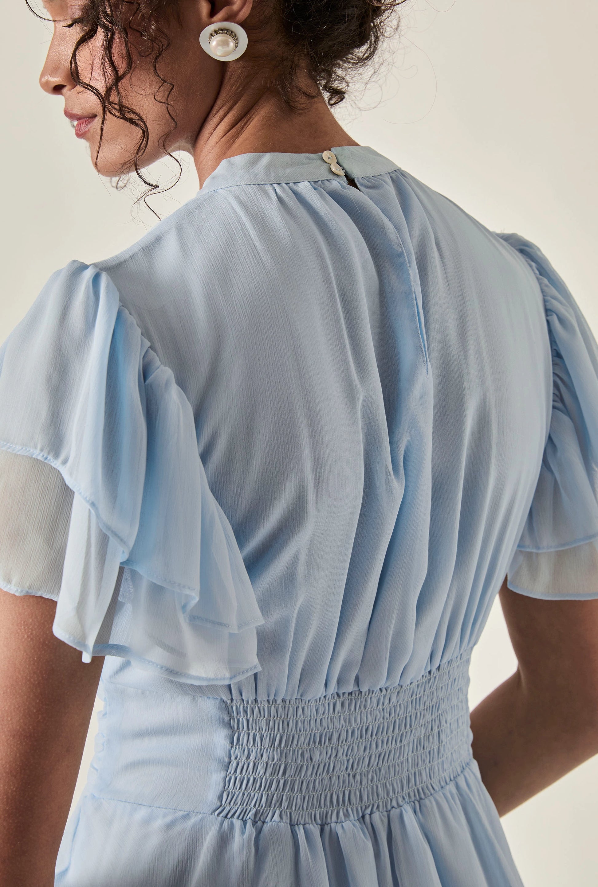 Pale Blue Tiered Ruffle Maxi Dress with button neckline and shirred waist – back detail