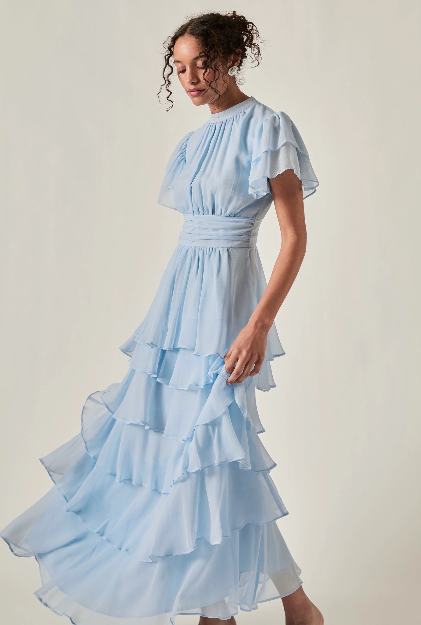 Model wearing Pale Blue Tiered Ruffle Maxi Dress – side view