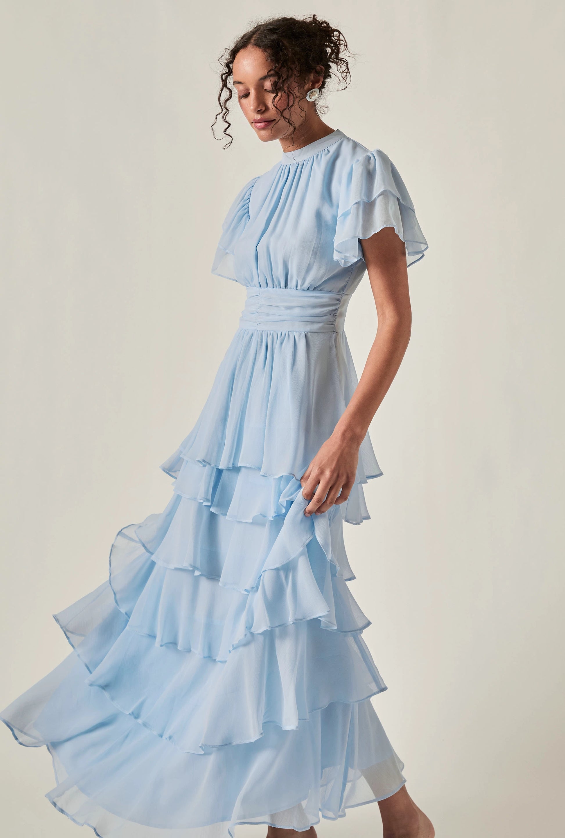 Model wearing Pale Blue Tiered Ruffle Maxi Dress – side view