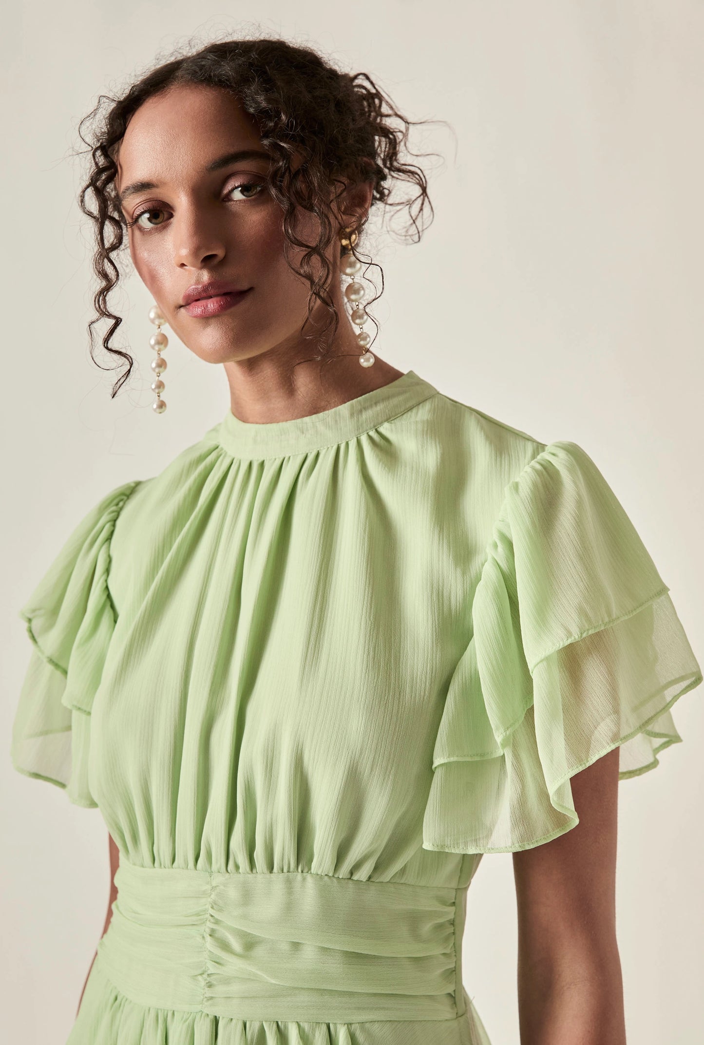 Green Tiered Ruffle Maxi Dress with gathered neckline and flutter sleeves