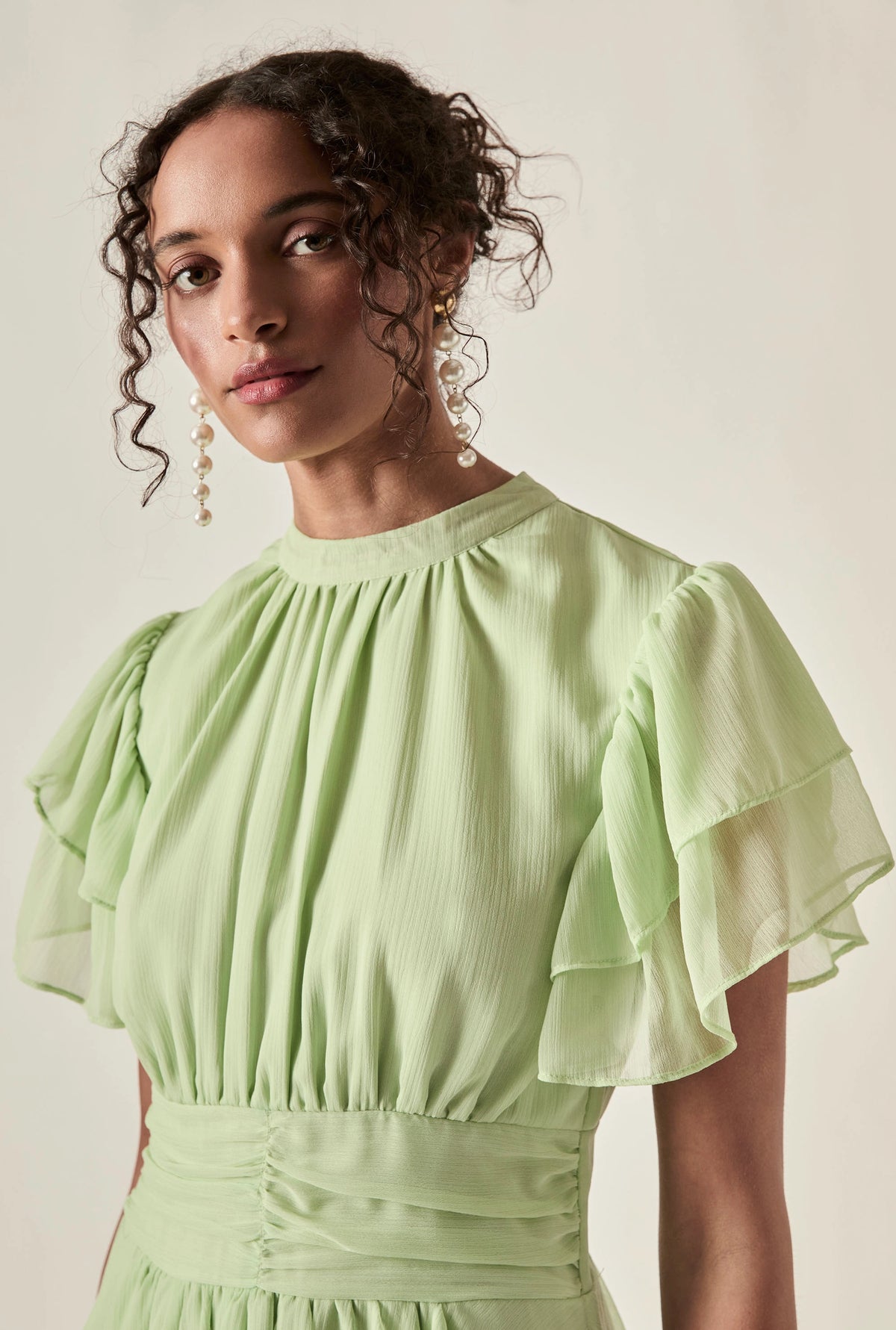 Green Tiered Ruffle Maxi Dress with gathered neckline and flutter sleeves